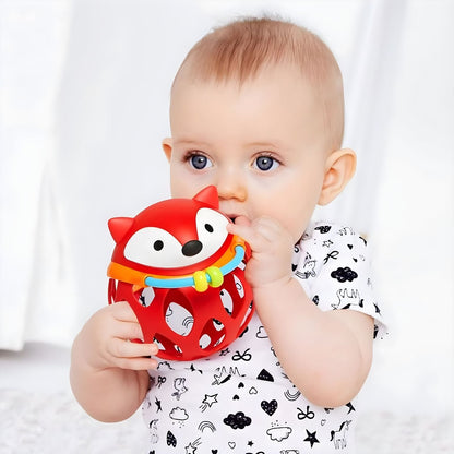 Skip Hop Red Fox Rattle Ball in the hands of babies in a moment of discovery