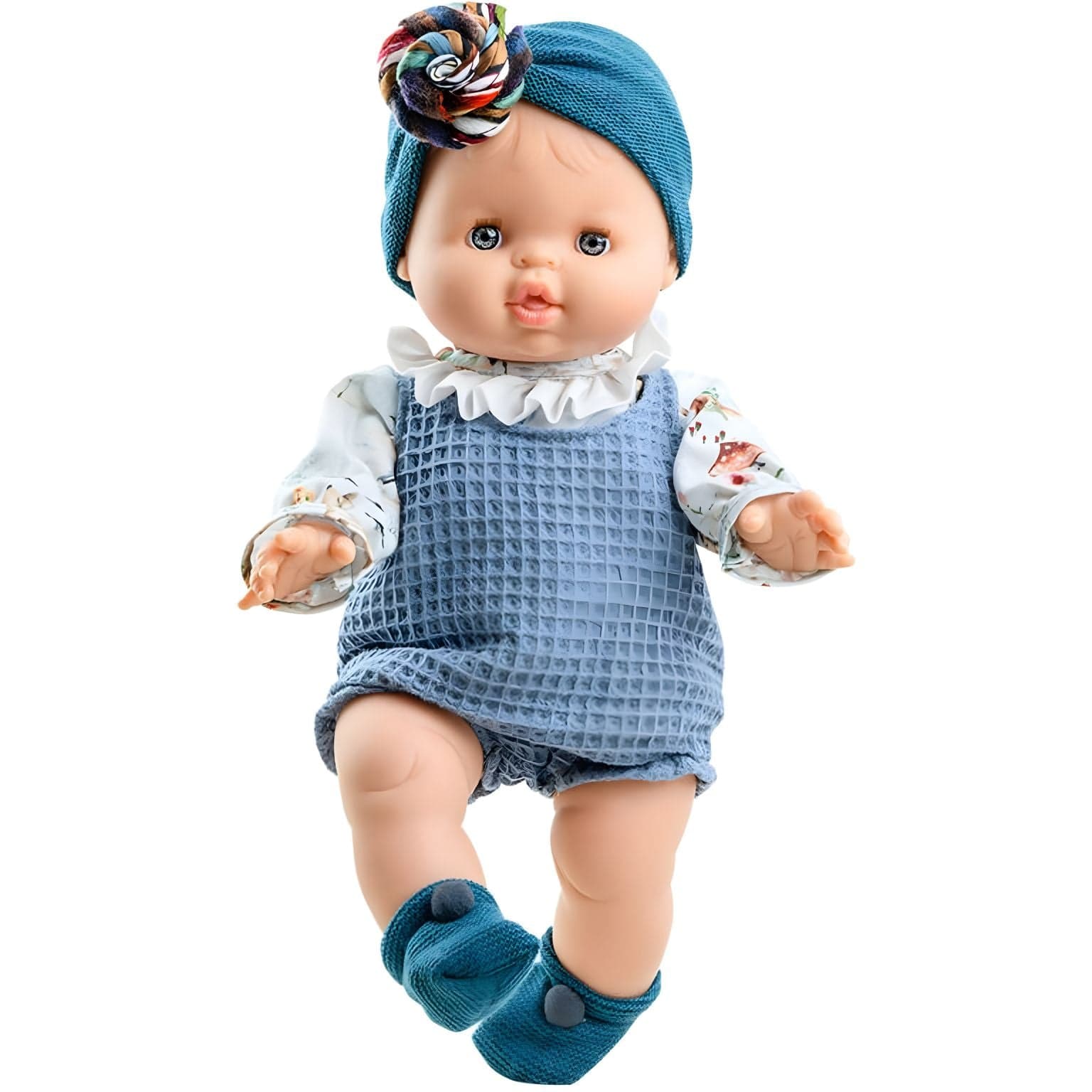Boneca Blanca de Paola Reina com roupa azul, gola branca e turbante azul com flor colorida