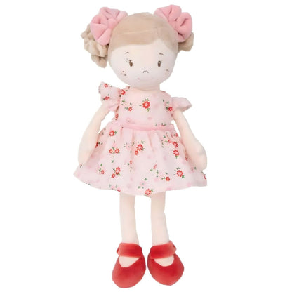 Vendela rag doll with pink floral dress, pink bows, and red shoes