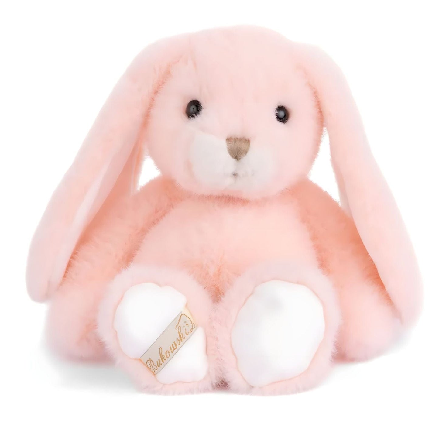 Coelho de peluche cor de pêssego com orelhas compridas, focinho creme e patas brancas