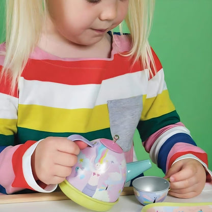 Children playing with a Musical Fantasy Tea Set in a colorful suitcase with unicorns and mermaids