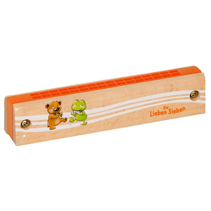 Child playing colorful 7 Friends children's harmonica from Spiegelburg