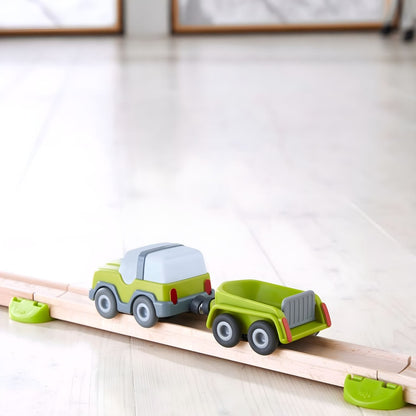 Play vehicle with trailer for action-loving children
