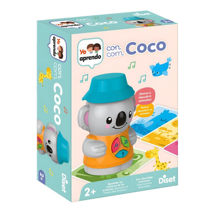 Child playing with "I Learn" Game: "I Learn with Coco" by Diset with illustrated cards and interactive doll