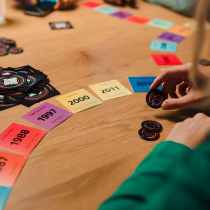 Jumbo Hitster Board Game with colorful cards of years and musical party game