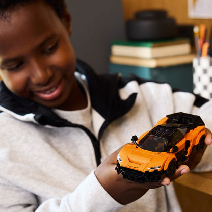 Lego Speed Champions McLaren W1 orange and black car with pilot minifigure and helmet