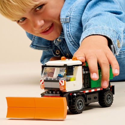 Lego City Snowplow with truck and front plow in a snowy setting
