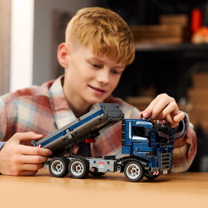 Blue LEGO Technic Dump Truck on a construction site