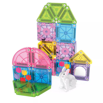 Child playing with the Magna-Tiles microMAGS Travel Spring Garden set