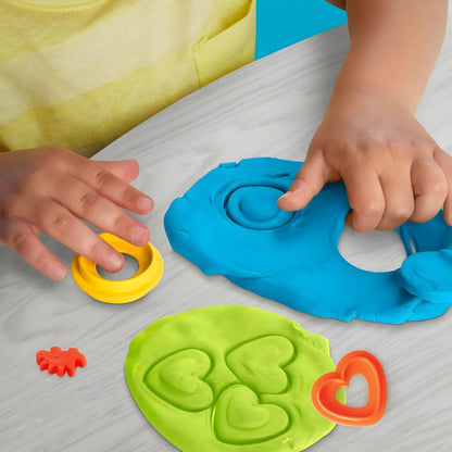 Detail of Play-Doh Dinosaur shapes and colors for sensory exploration