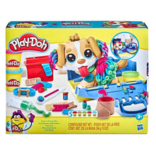 Criança a brincar com o Play Doh Kit veterinário e cachorrinho de massa colorida