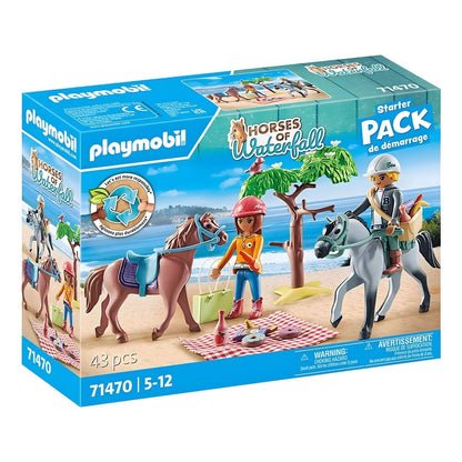 Playmobil Horseback Ride with two figures, two horses, a tree, and a picnic on the beach