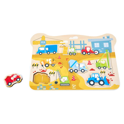 Hape puzzle with construction vehicles and knobbed pieces