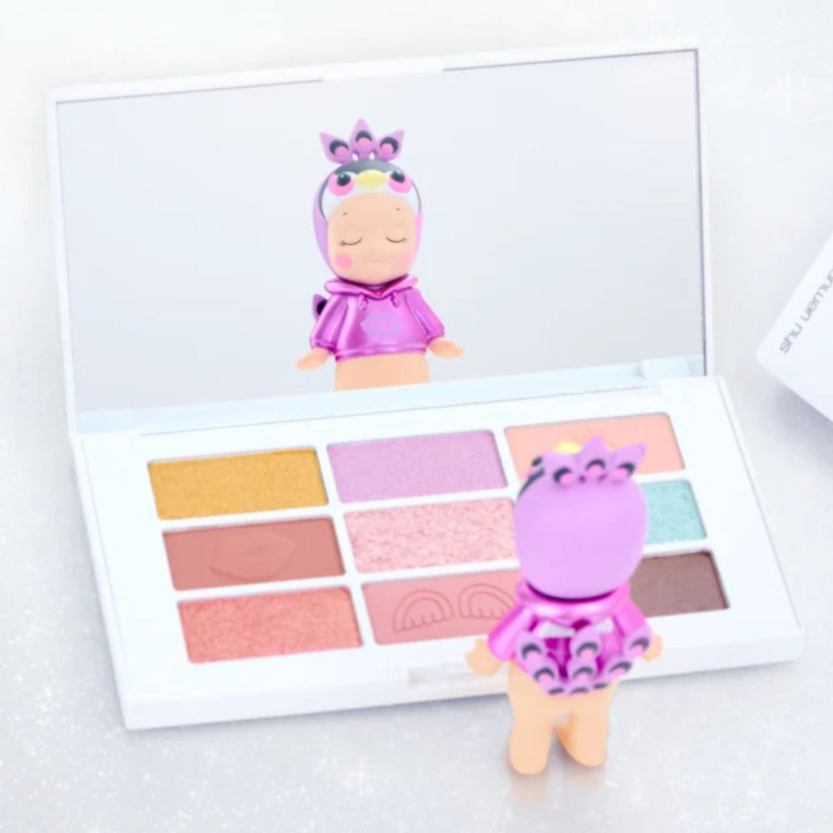 Pink-toned detail from the Sonny Angel x shu uemura Makeup Angel Series