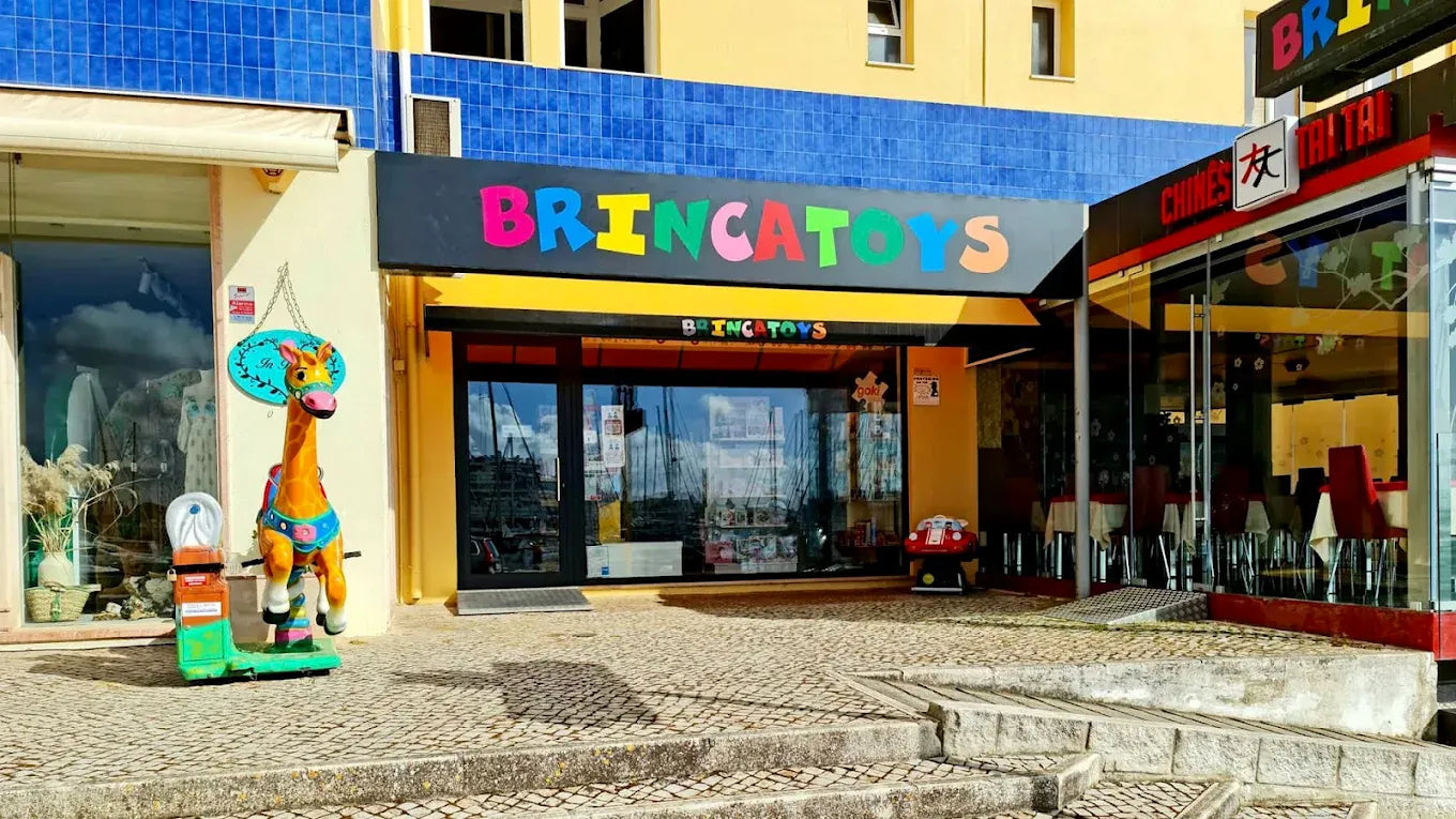 Entrance to the Brincatoys shop in Vilamoura, with its colourful sign and a giraffe by the door.