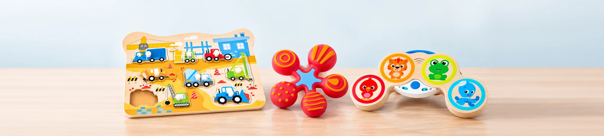 A wooden puzzle, teether and musical toy for babies.